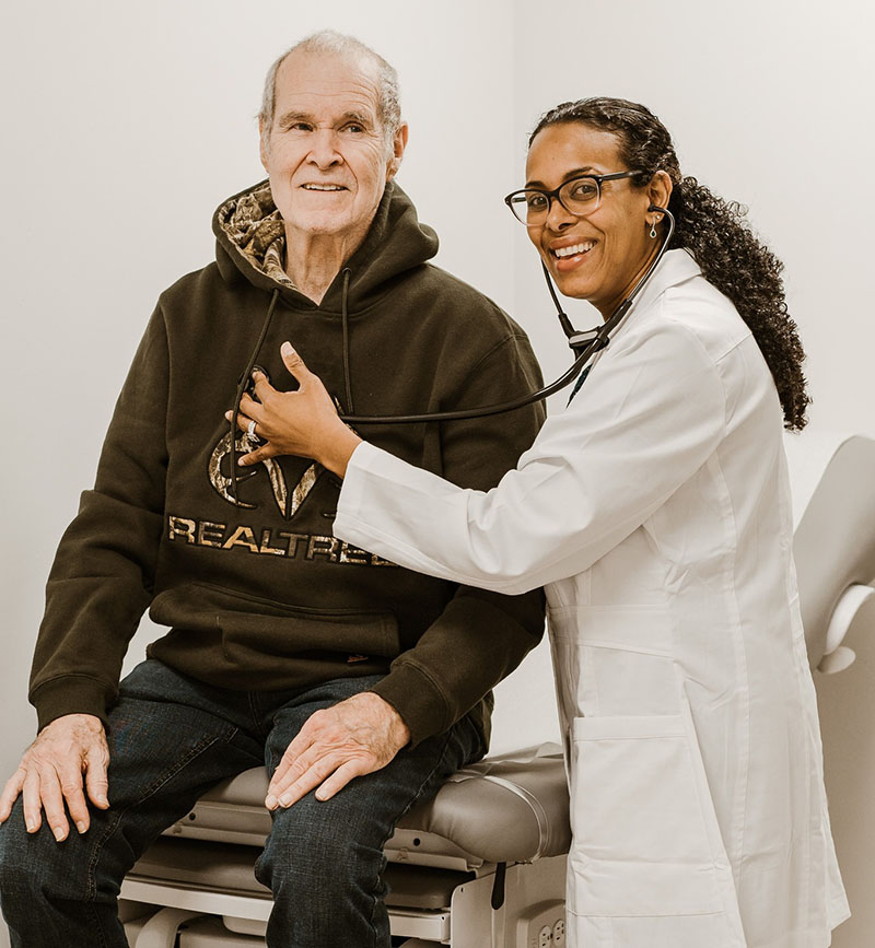 A VIP Medical Care physician with a patient
